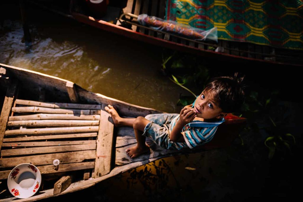 Young Khmer on his boat